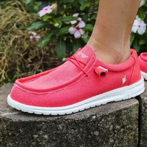 Close up of woman posing in FROGG TOGGS Red Java Women's Slip-on Waterproof Breathable Shoe.