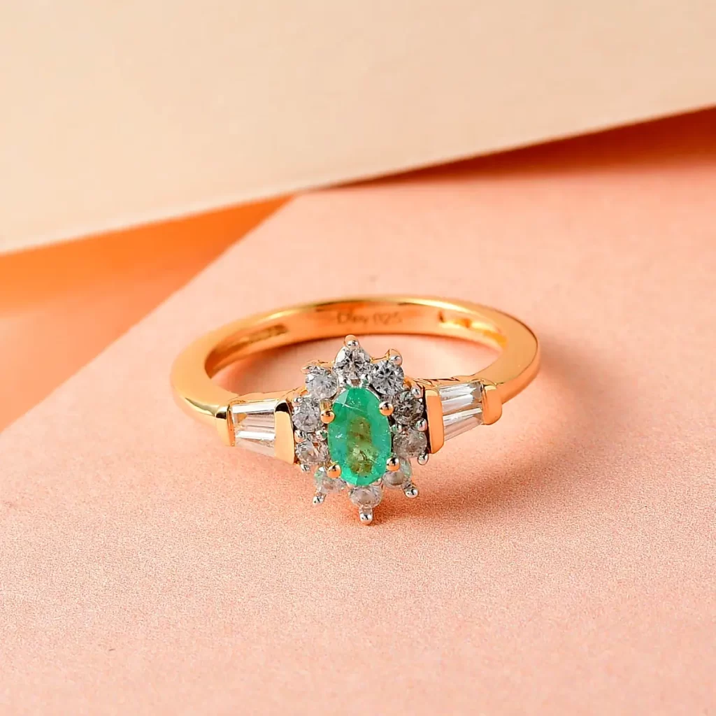 Columbian emerald halo ring in silver