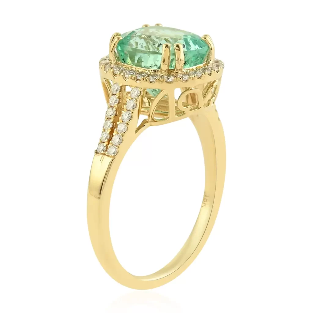 Columbian emerald halo ring in gold