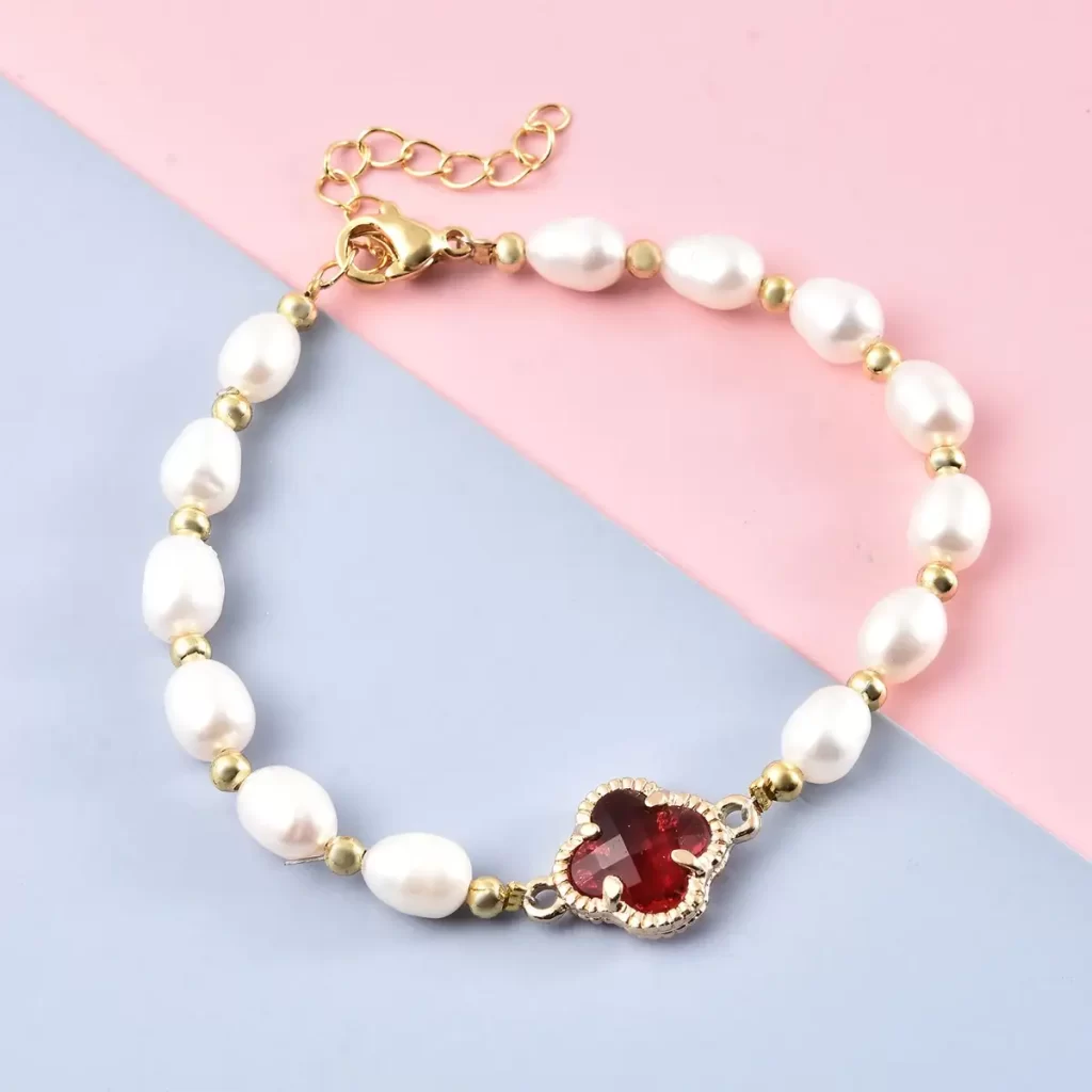 Simulated Ruby and White Freshwater Pearl Bracelet With Four Clover Leaf Charm