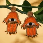 statement earring trend Handcrafted Orange Seed Beaded Hamsa Design Earrings in Goldtone
